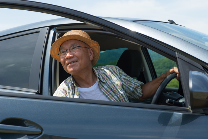 elderly man in a car