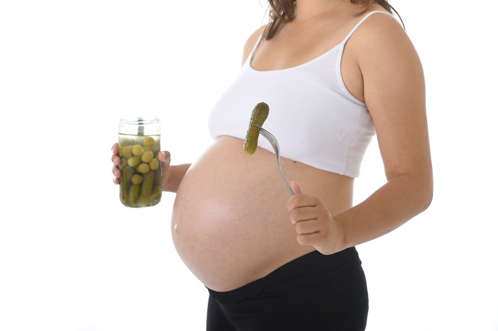 pregnant woman eating pickles