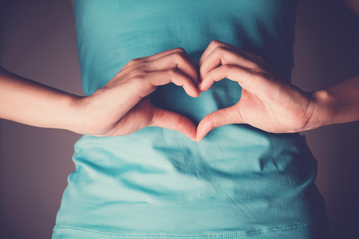 woman's hand in shape of heart