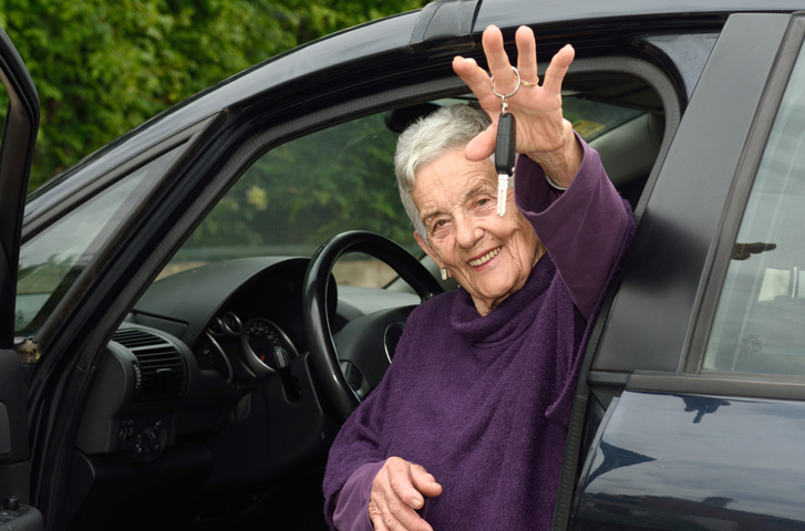 older woman in car