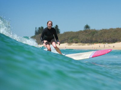 Dr Rebecca Olive surfing
