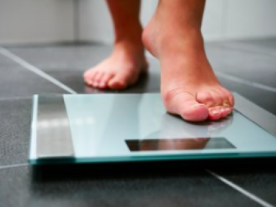 person standing on scales