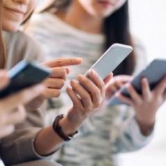 Teenagers using phones
