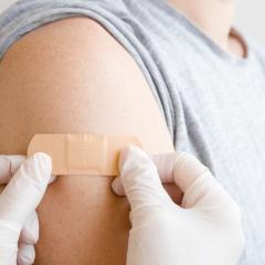 Bandaid being put on shoulder