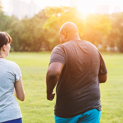 male and female running in park