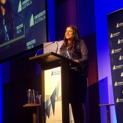 Arosha Weerakoon accepting her award in Canberra