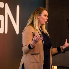 Anthea Bott presenting on a stage