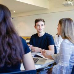 a group of psychology students sitting around a table