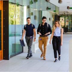 Three dentistry students walking