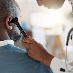 Doctor assessing a patient's hearing