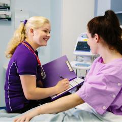 Nursing student with patient