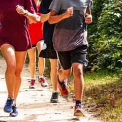 Group of teenagers running on trail