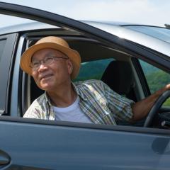 elderly man in a car