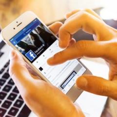 person using Facebook on their phone