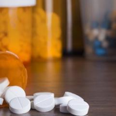 bottle of white circular pills 