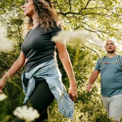 man and woman bushwalking