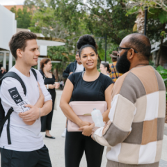 Three students talking casually