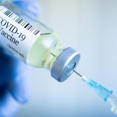 COVID-19 vaccine and syringe 