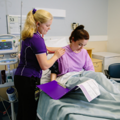 Student nurse with patient