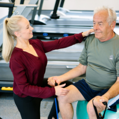 Physiotherapy student with patient 