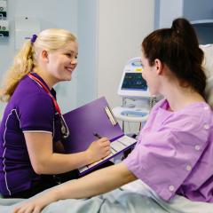 Image of nursing student with patient