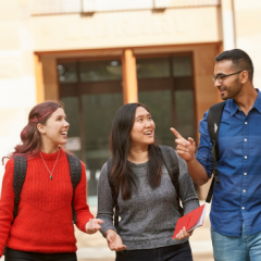 Three students in Duhig Courtyard