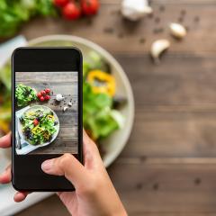 image of someone taking a photo of a salad
