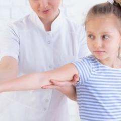 physiotherapist and child