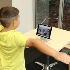 boy doing telerehabilitation