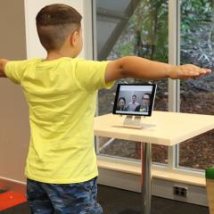 child doing telerehabilitation