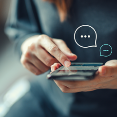 woman using phone with chat icons above