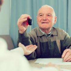 older man with car keys