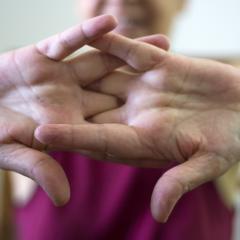 person cracking knuckle