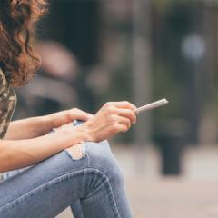 woman holding a joint