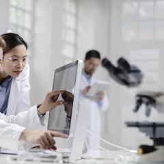 pharmacists looking at a computer screen