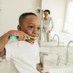 child brushing teeth