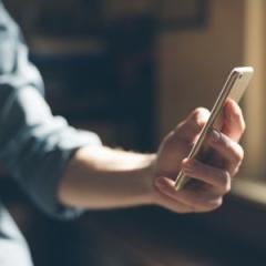 person sending a text message