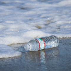 plastic bottle discarded on beach
