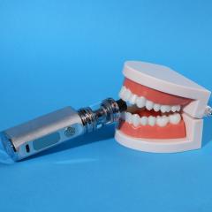 A vape device in a set of chattering teeth