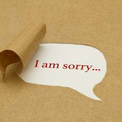 speech bubble with word 'I am Sorry' in the middle