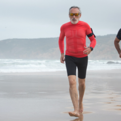 two men running on beach
