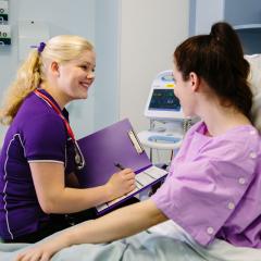 Student on placement at bedside of patient 