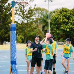 Student on placement at netball courts