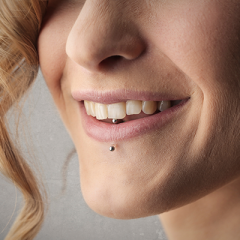 Woman with mouth piercing 