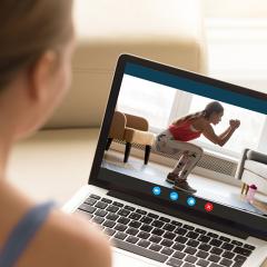 woman looking at workout online