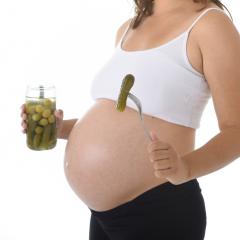 pregnant woman eating pickles